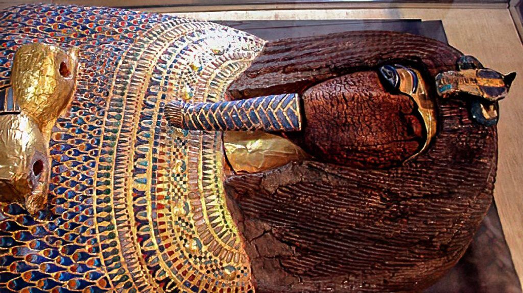 Gilded and inlaid wooden coffin from KV55 in the Valley of the Kings, now in the Egyptian Museum of Antiquities in Cairo. The face and the cartouche containing the name of the coffin's occupant were defaced in ancient times. Image: Hans Ollermann