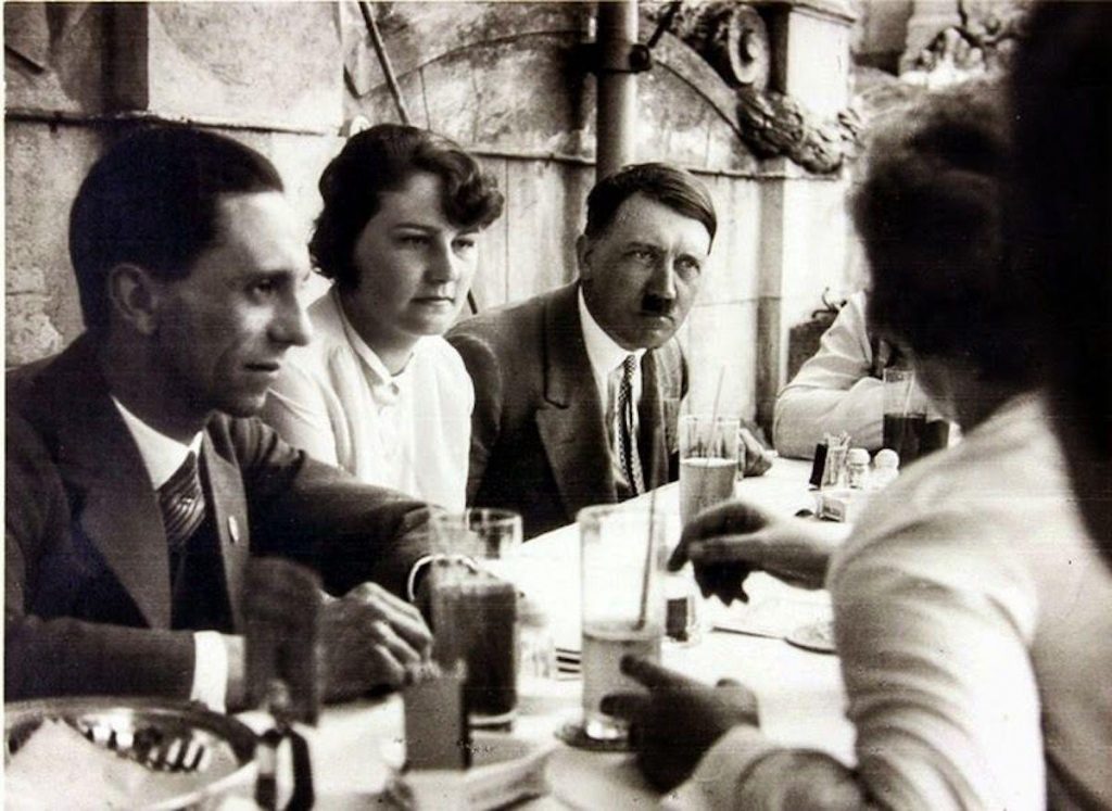 Geli Raubal (L) and Adolf Hitler (R) at a garden party in the 1930s. Photo by: Universal History Archive/Universal Images Group.