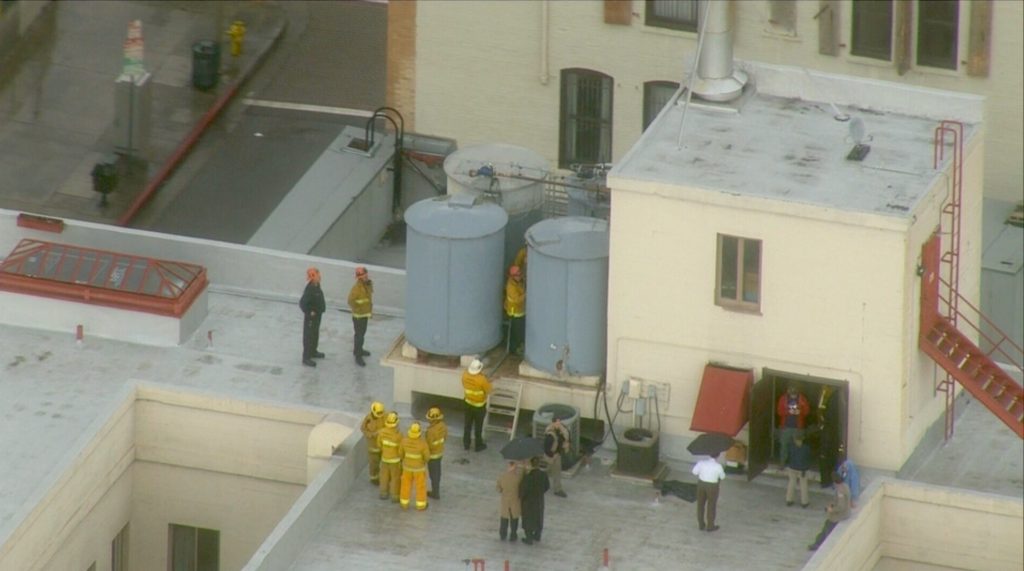 Footage of the recovery effort to remove Lam's body from water tanks of the Cecil Hotel.