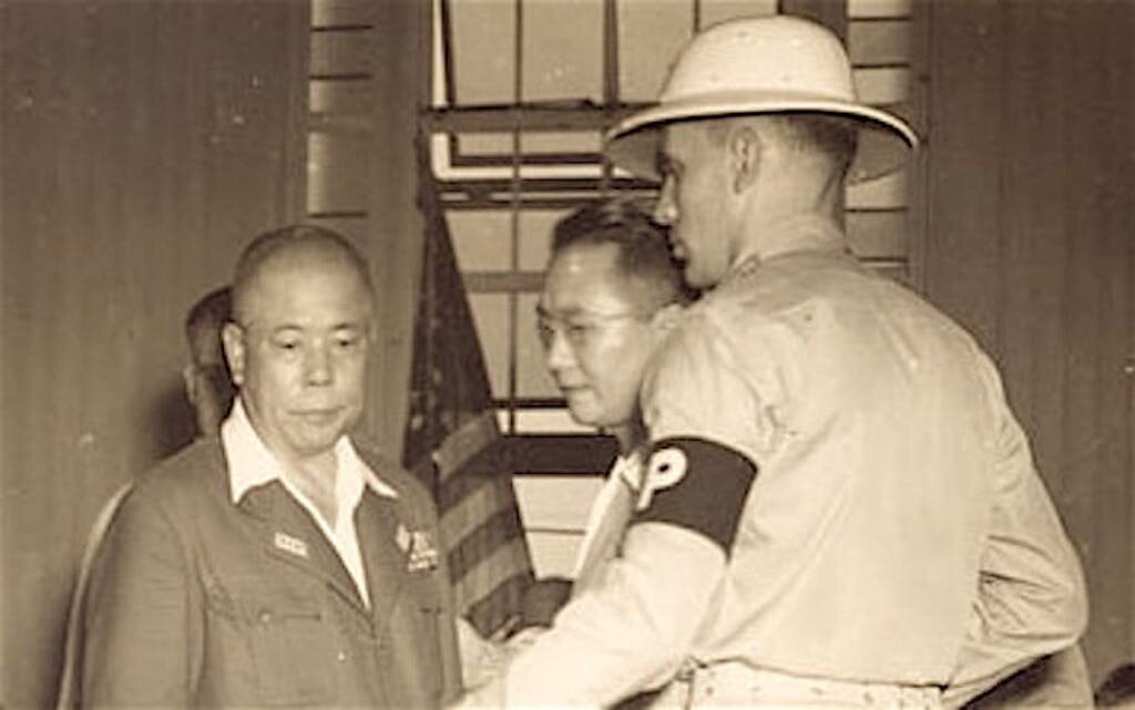 Yamashita is escorted out of the courtroom immediately after being sentenced to death by hanging, 31 December 1945.