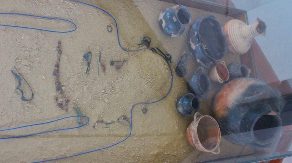 An exhibit of the grave of "the woman," tomb 36, from Gricignano, Campania.