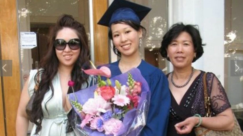 Elisa on her graduation day with her sister and mother. Image: Facebook.