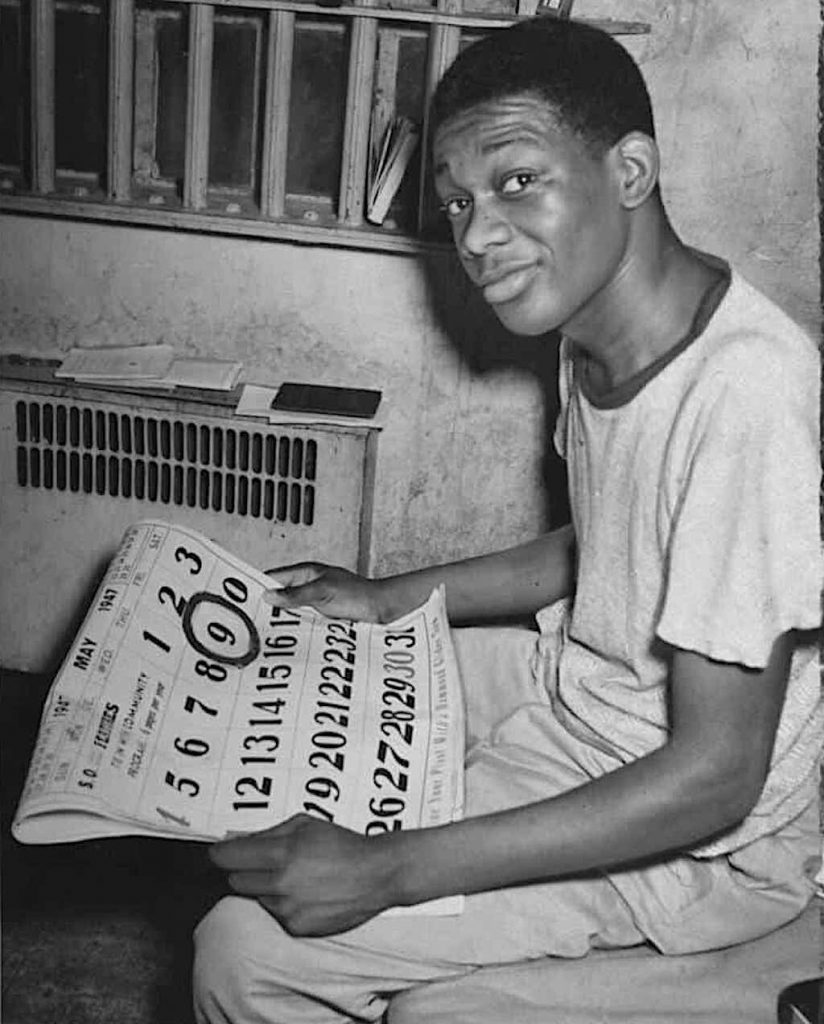 Willie Francis holds a calendar showing the date of his execution circled.