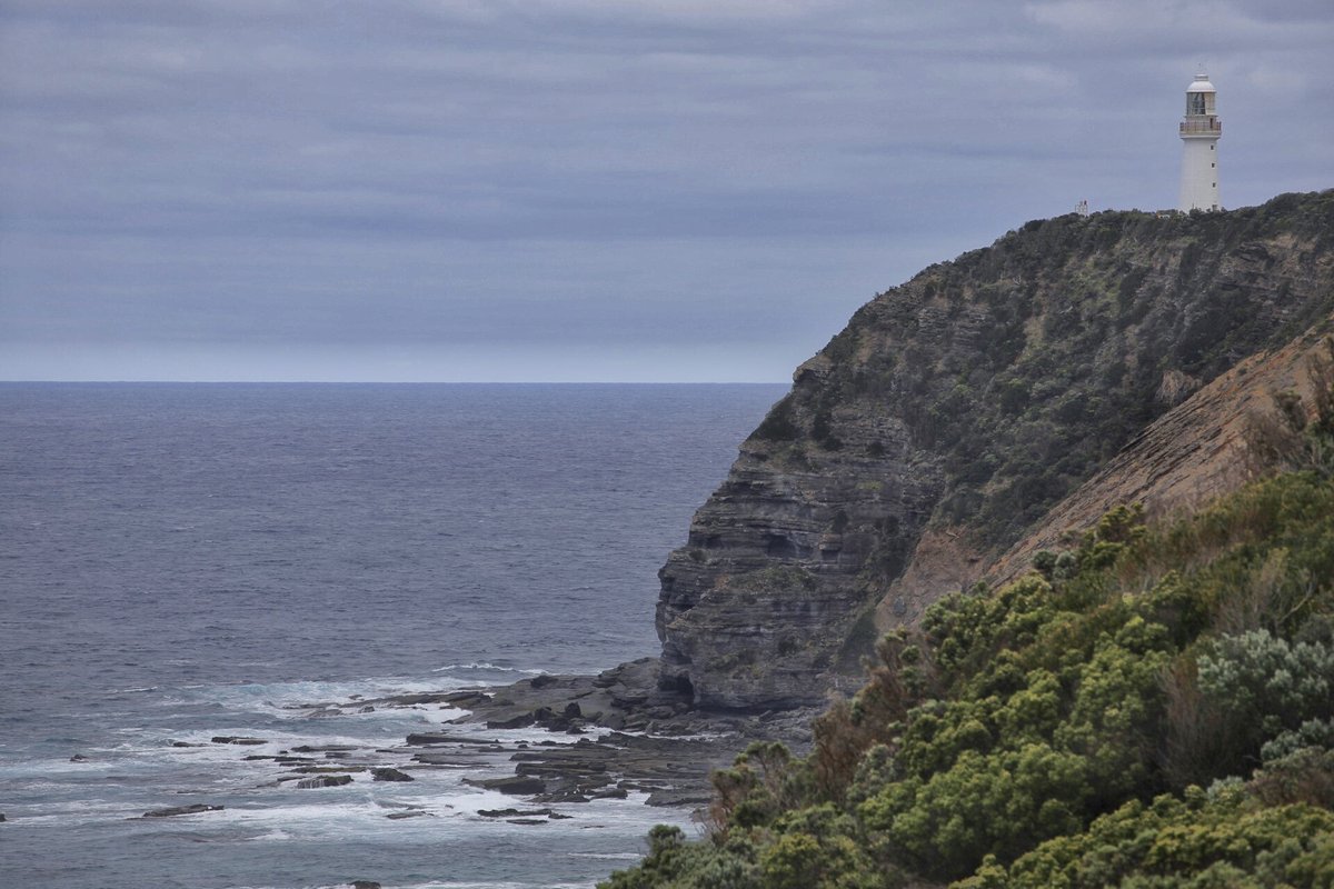 Cape Otway Lighthouse on a green clifftop above the sea of Bass Strait